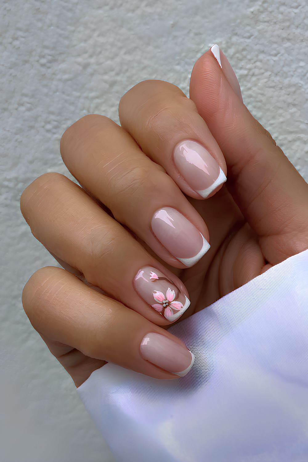 White French nails with cherry blossom art