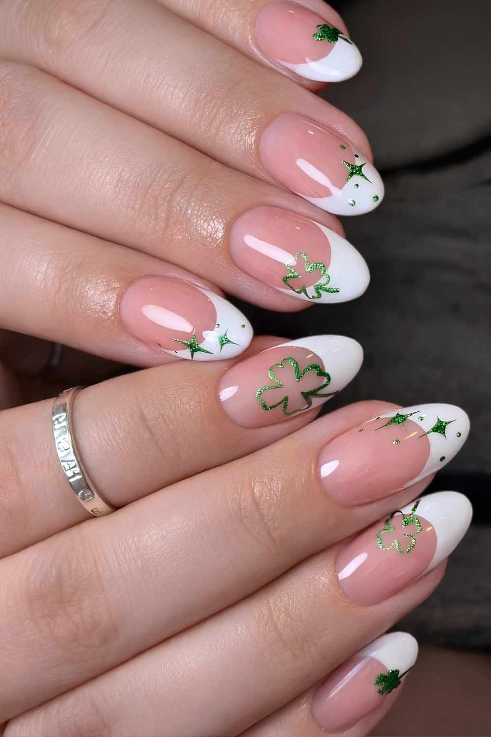 White French nails with clover art
