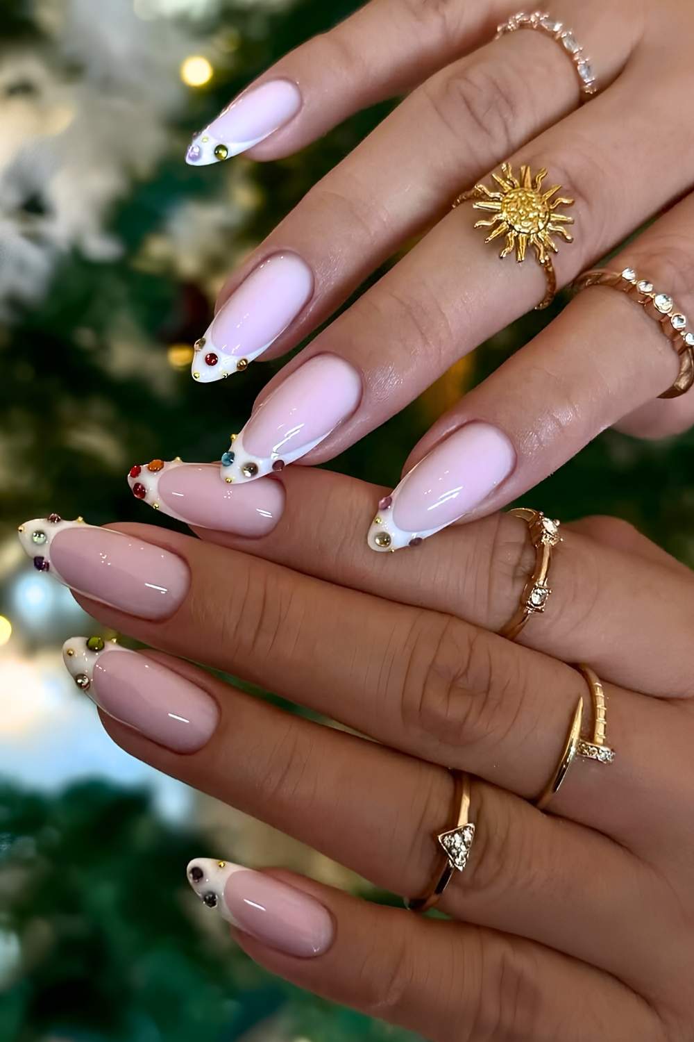 White French nails with colorful rhinestones