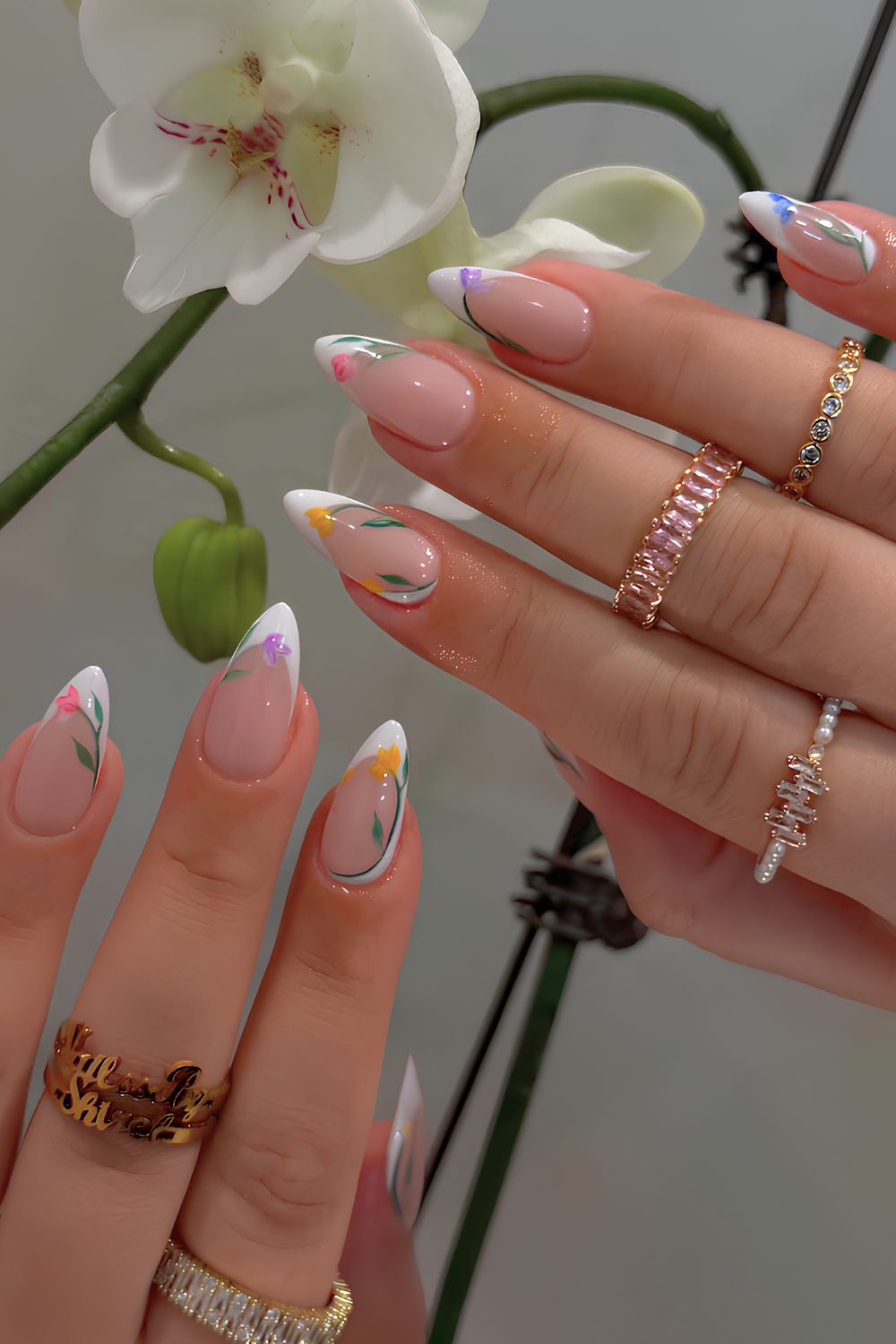 White French nails with colorful tulip art