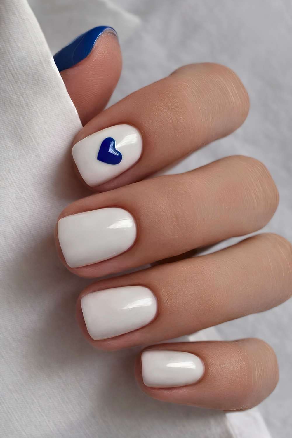 White and blue mani with accent heart