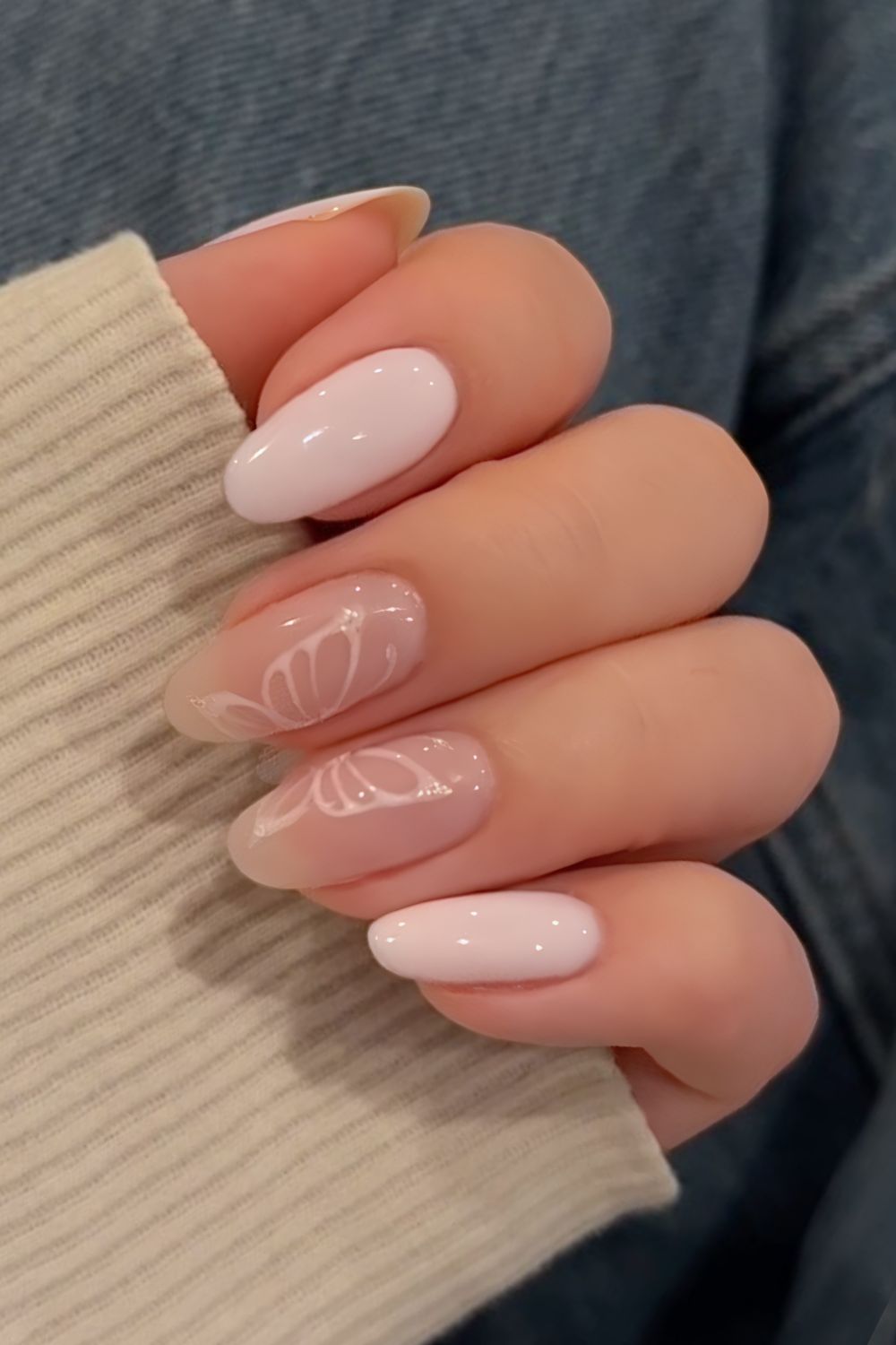 White and neutral nails with butterfly accents