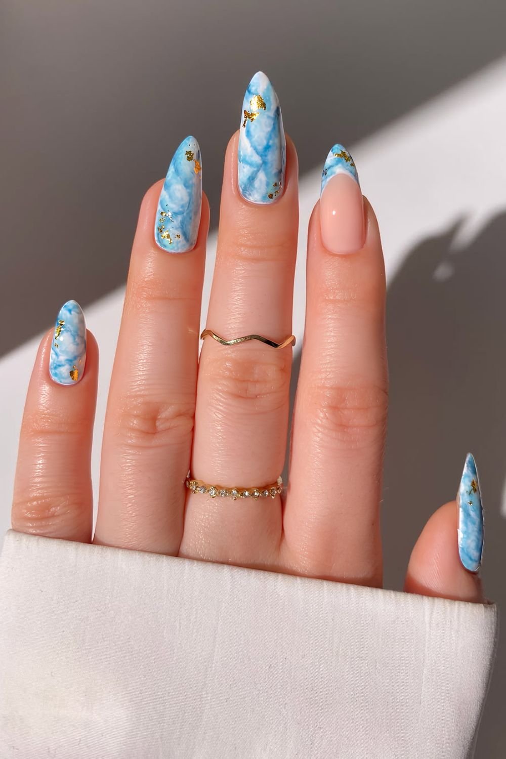 White and turquoise ink nails with gold foil flakes