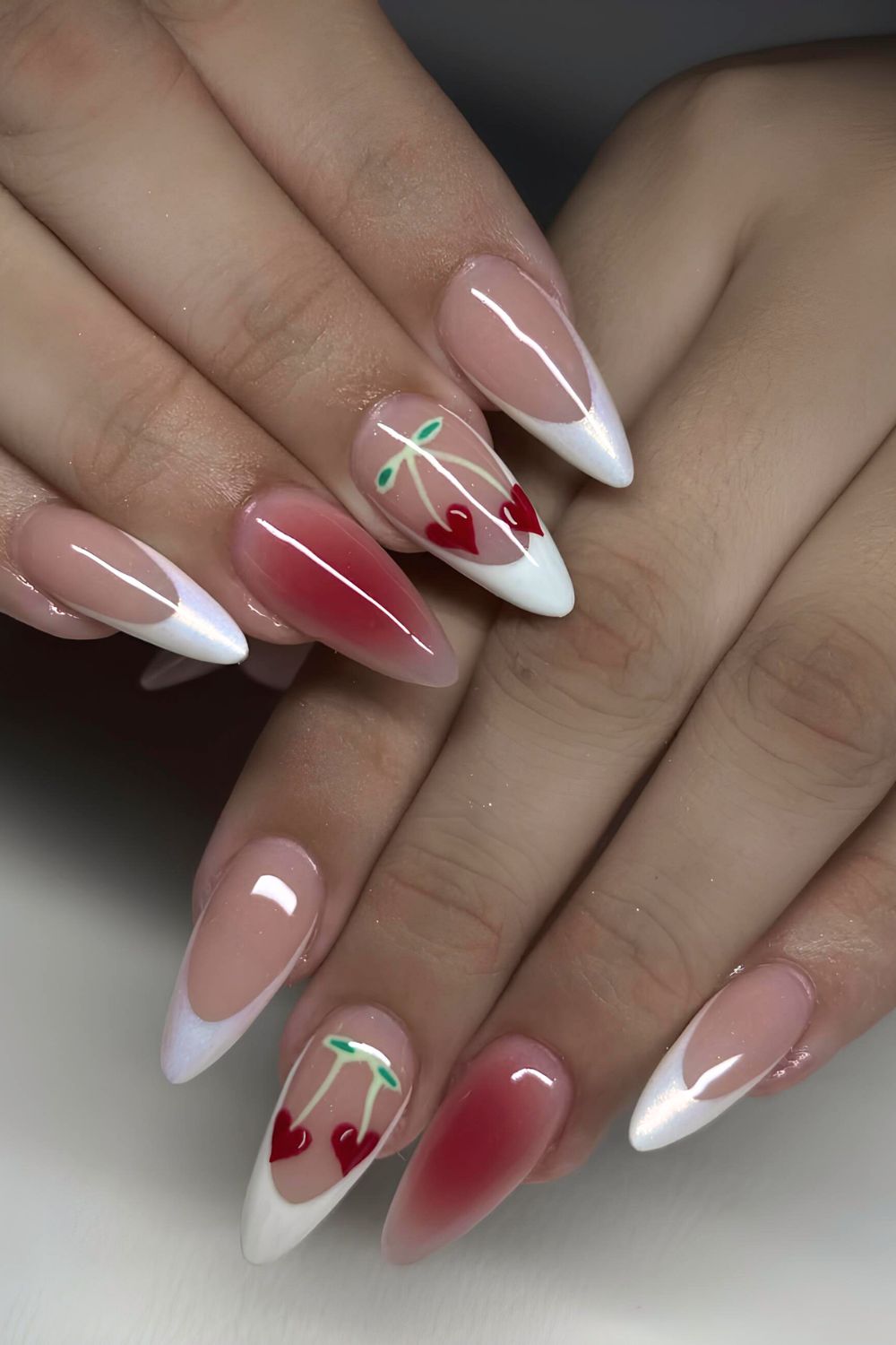 White chrme French tip naisl with aura effect and cherry accents