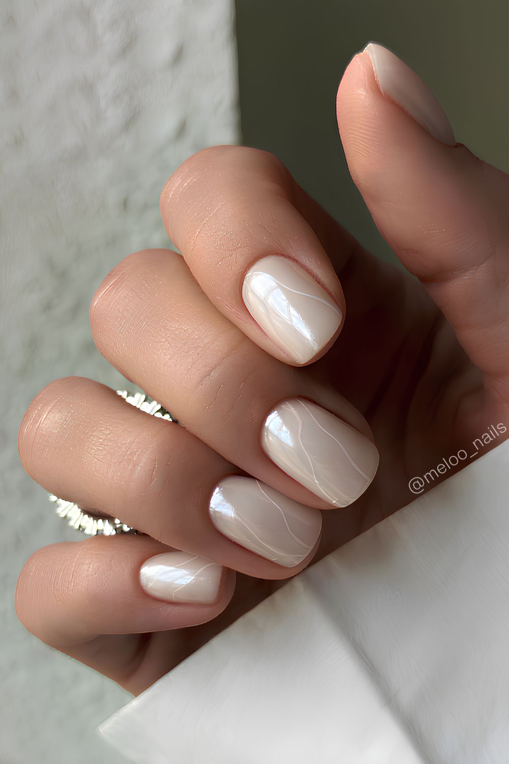 White chrome mani with accent swirls