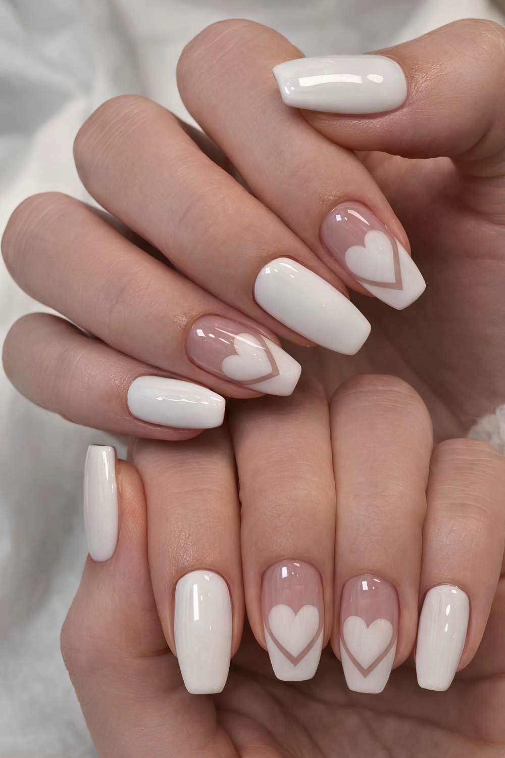 White mani with hearts and accent French tips