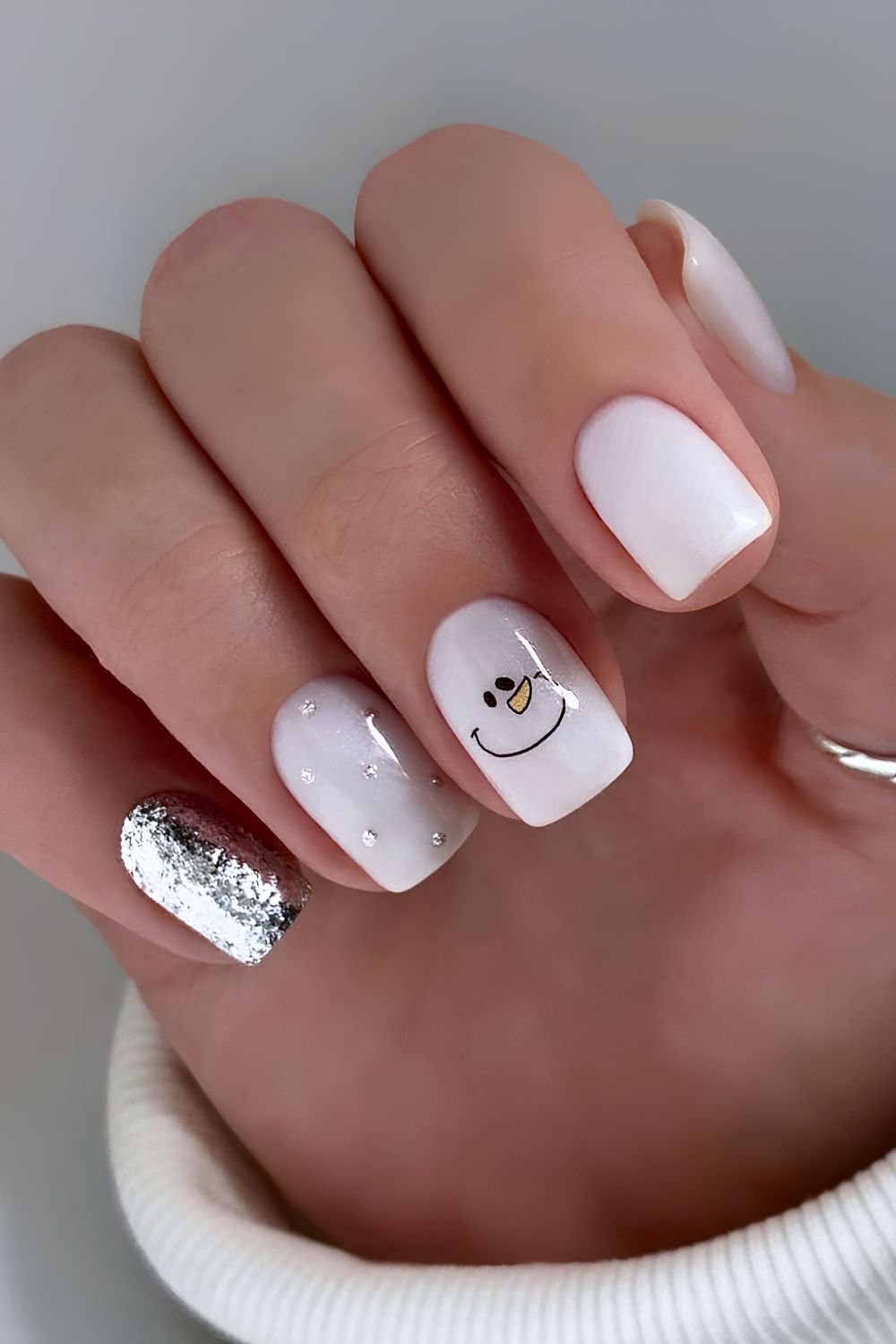 White manicure with snowman art
