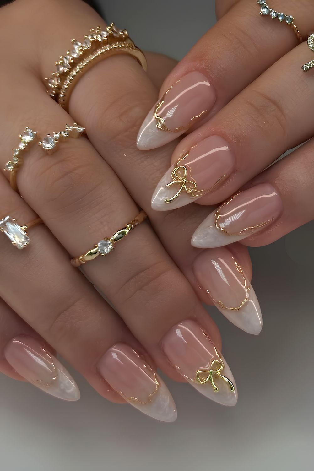 White marble french mani with gold bows