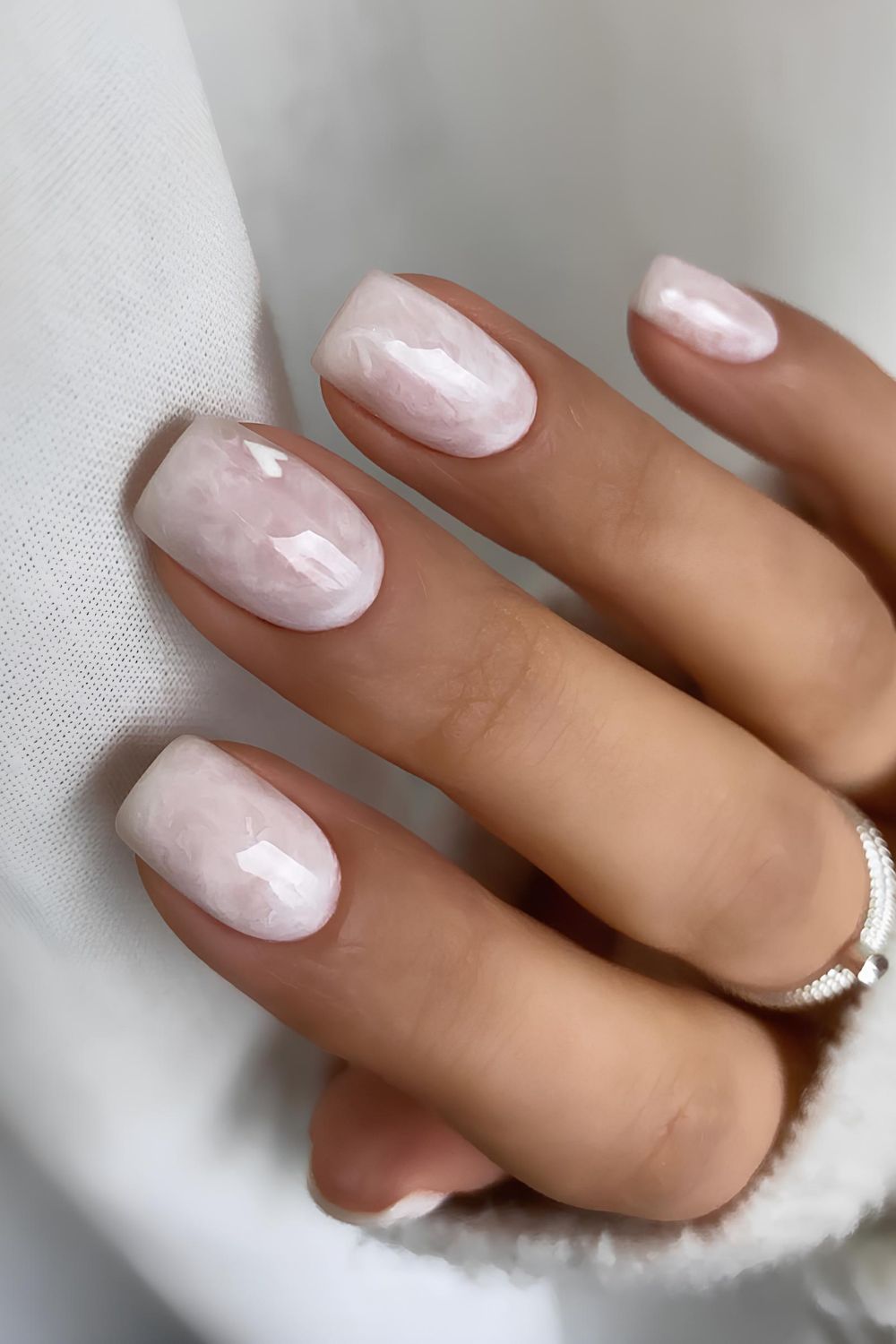 White marble nails with heart accent