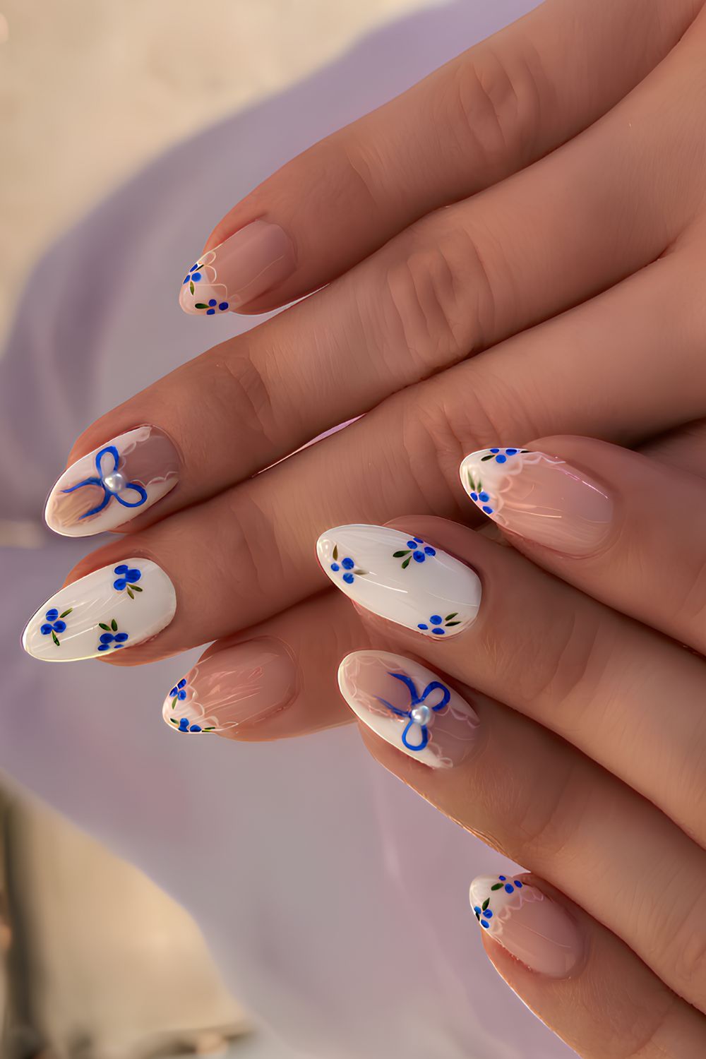 White nails with blueberry and bow art