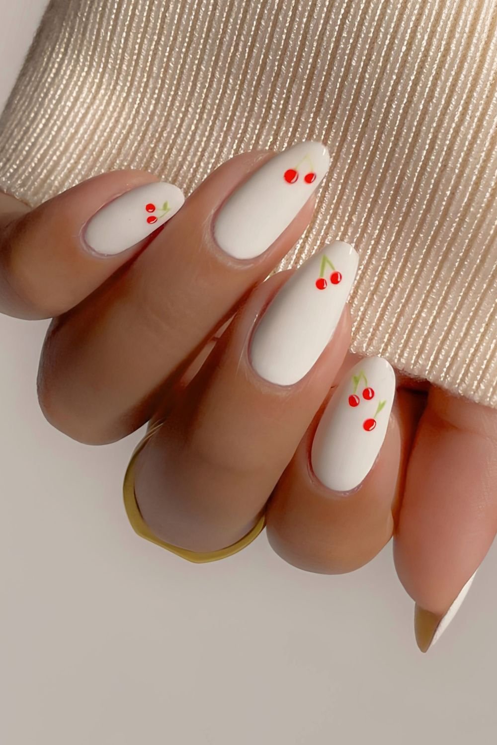 White nails with cherries