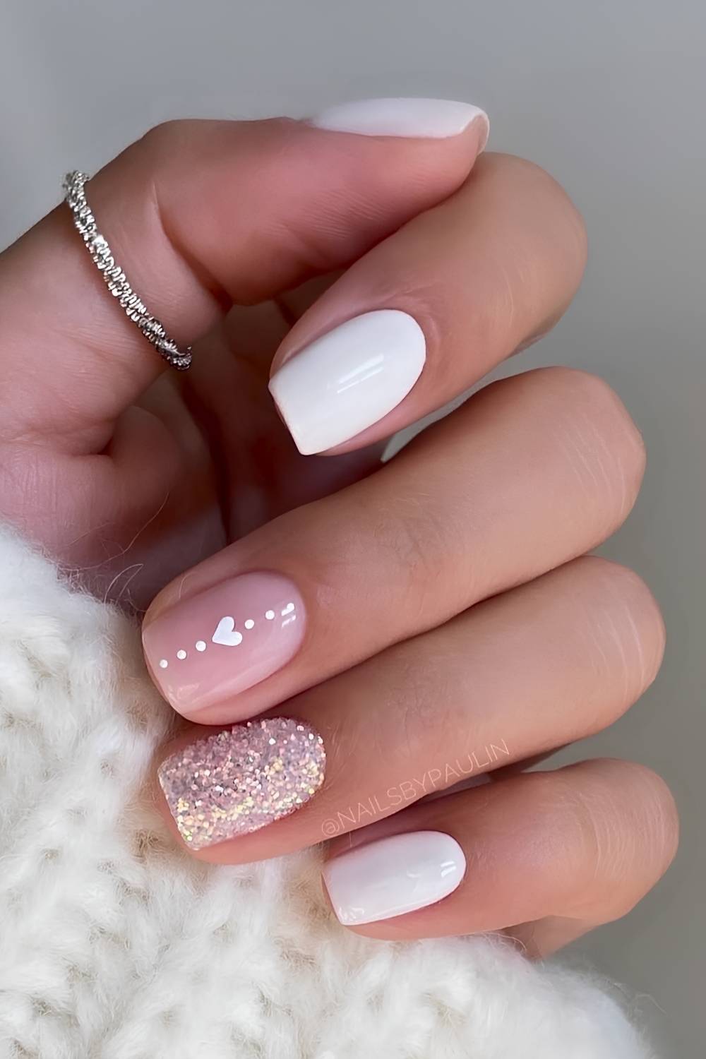 White nails with hearts and glitter