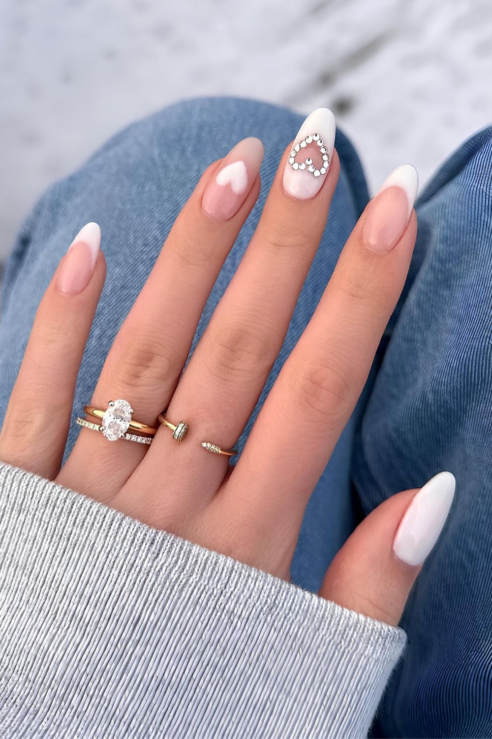 White nails with rhinestone heart accent
