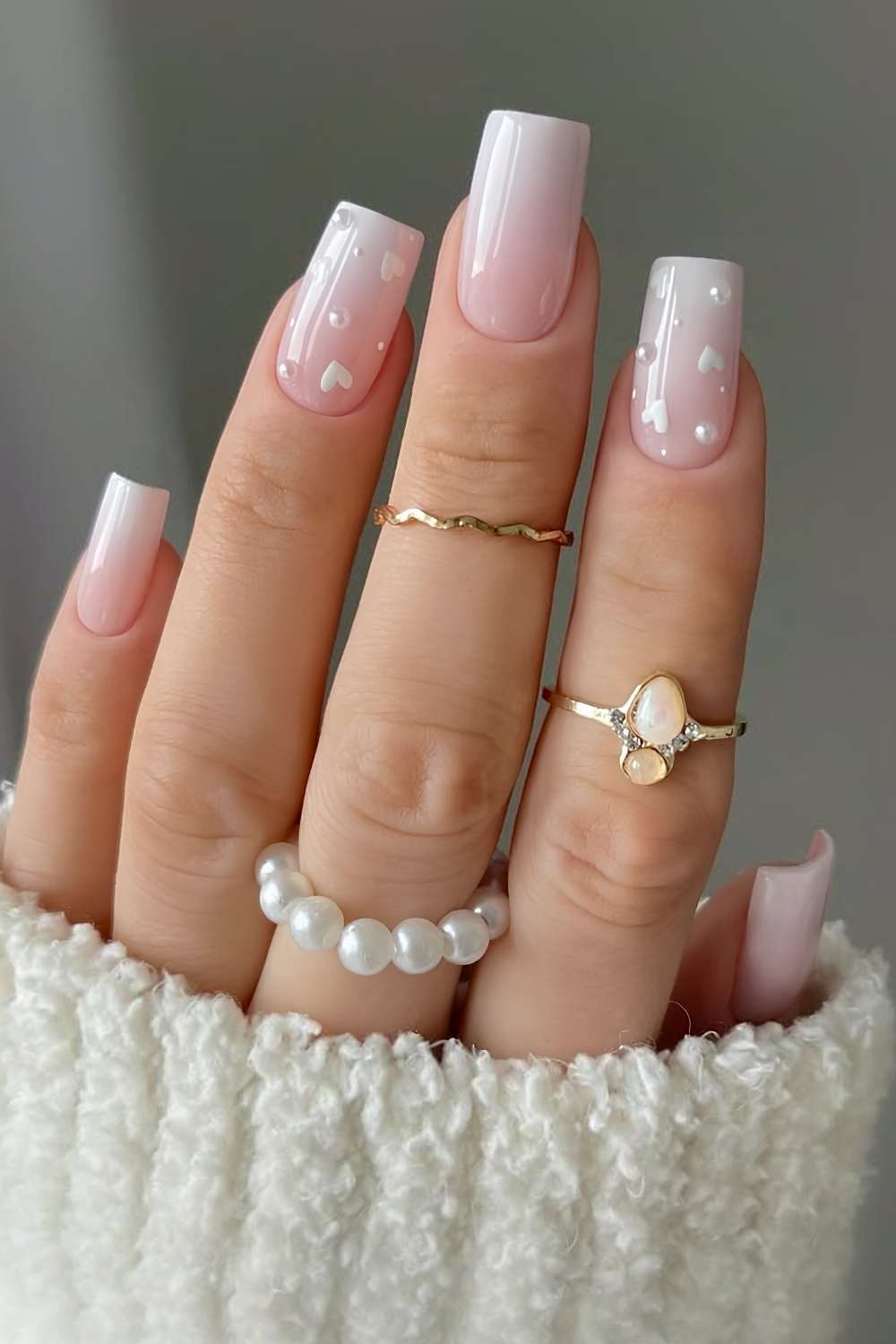 White ombre nails with hearts and micro pearls