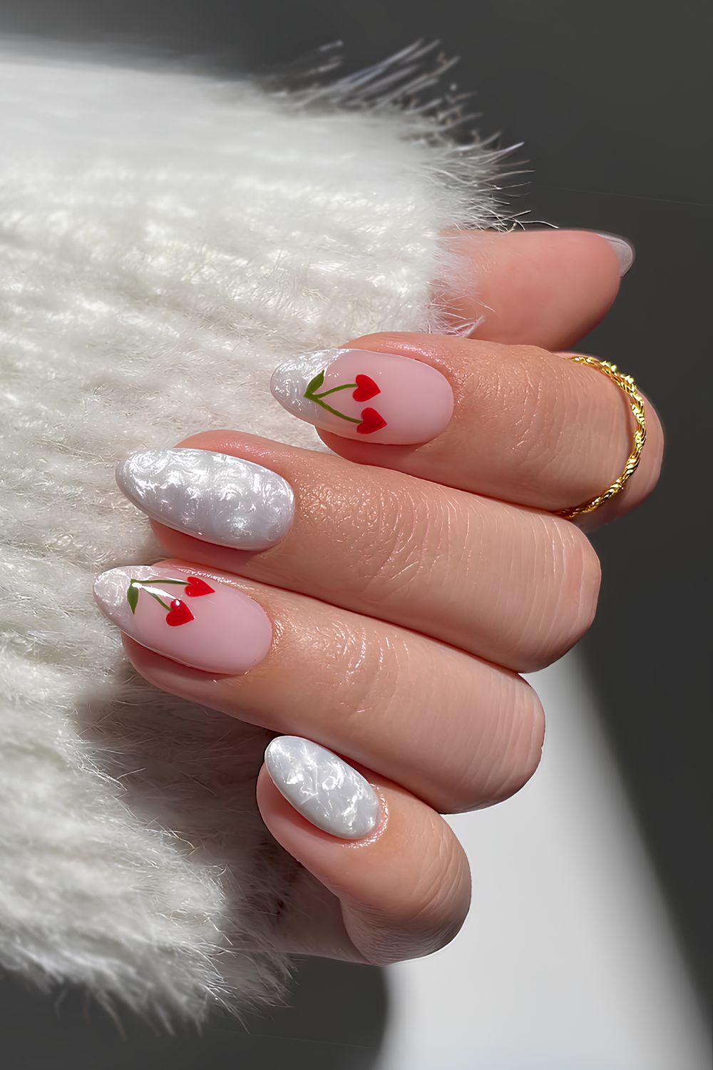 White pearly nails with cherry accents