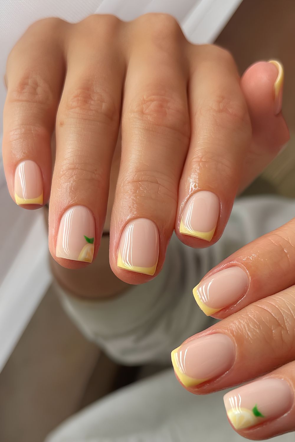 Yellow French manicure with lemons