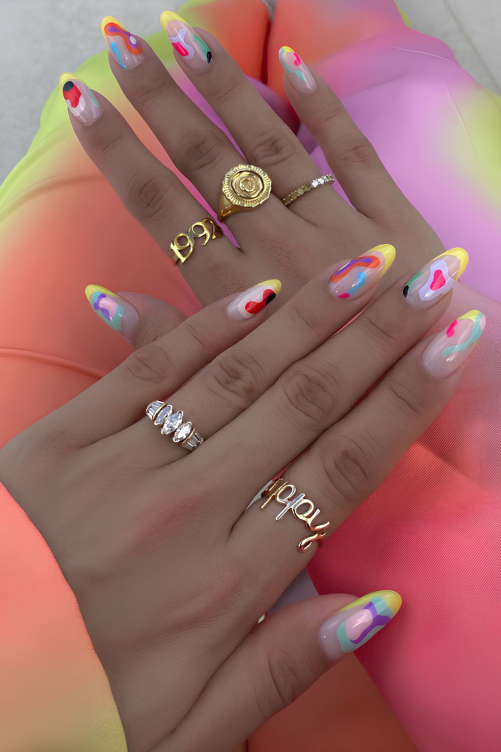 Yellow French nails with swirls