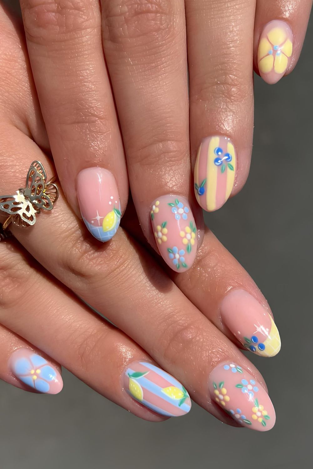 Yellow and blue mani with blueberry and lemon art