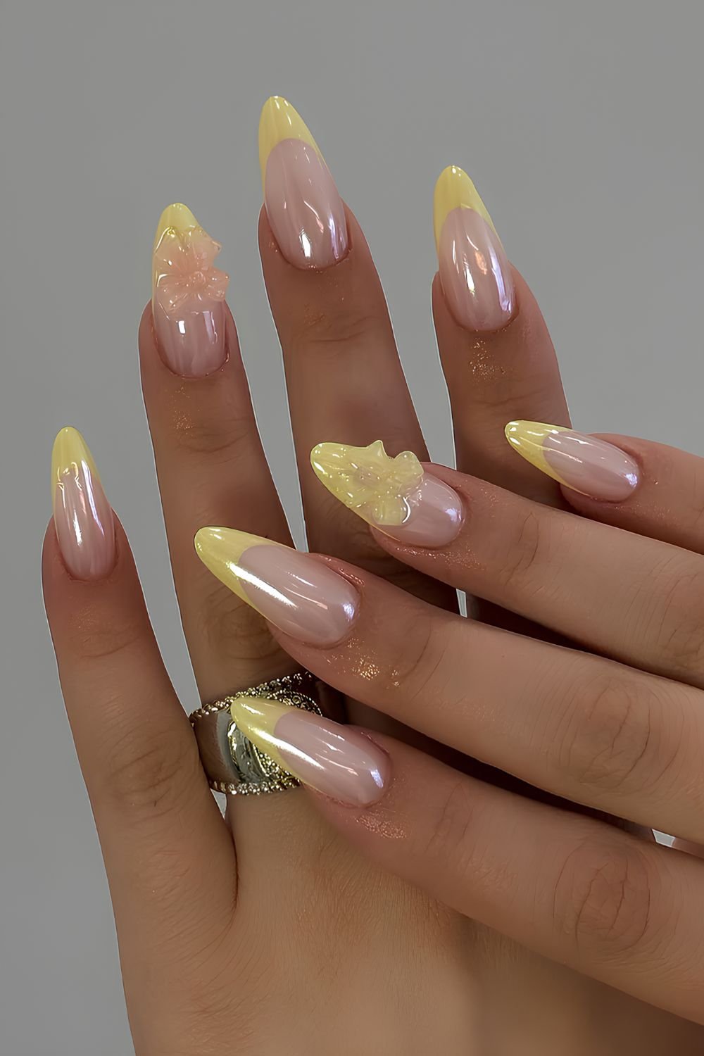Yellow chrome French mani with textured bows