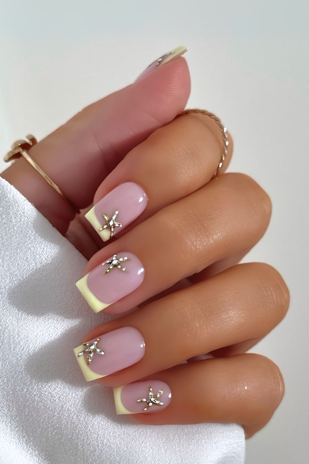 Yellow french tips with gold starfish accents