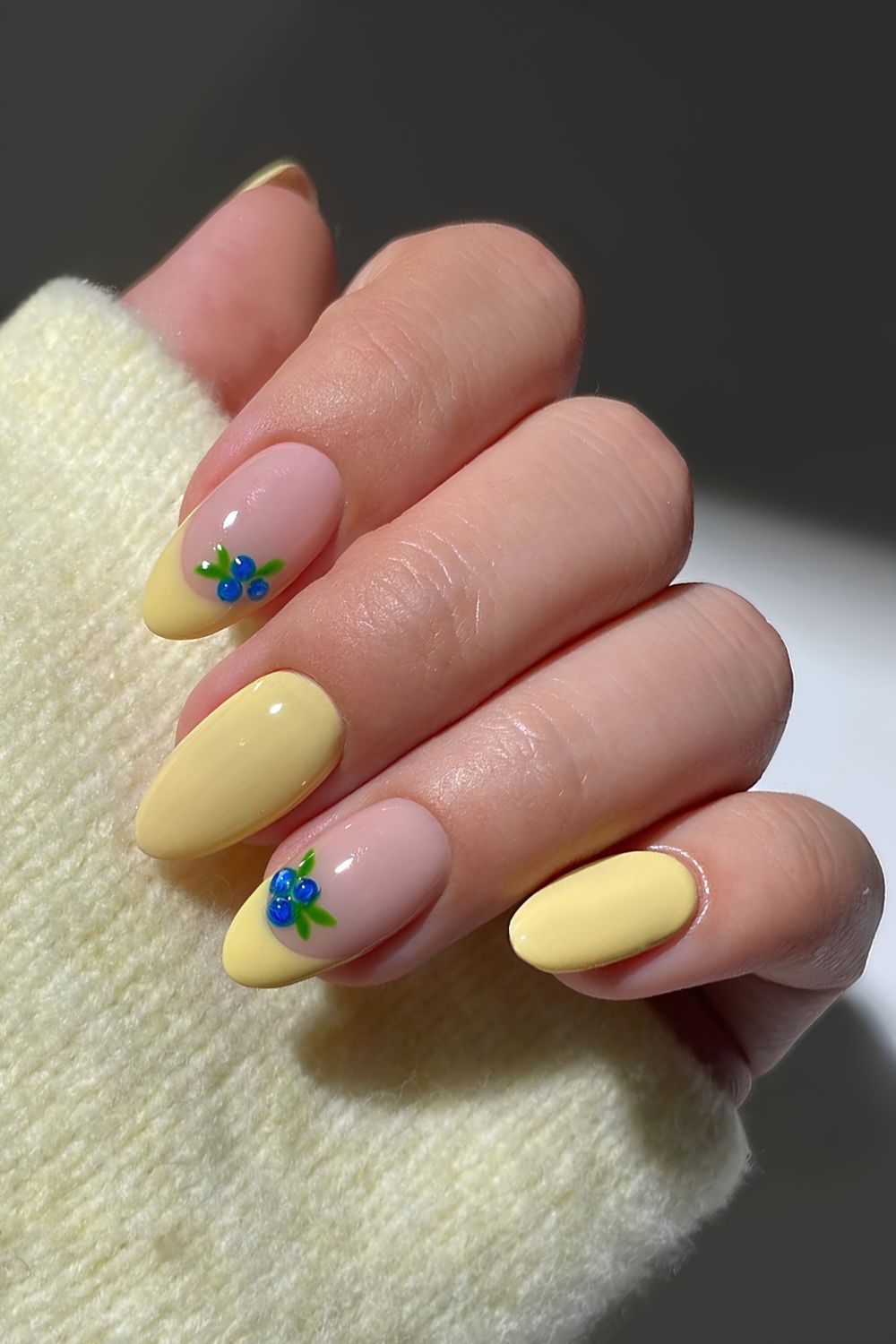 Yellow nails with blueberry art